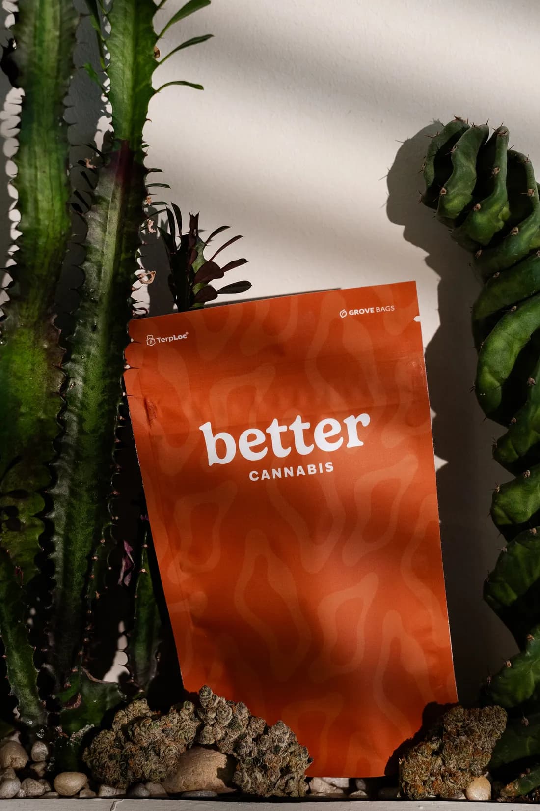 A Better Cannabis flower pouch styled on natural stone